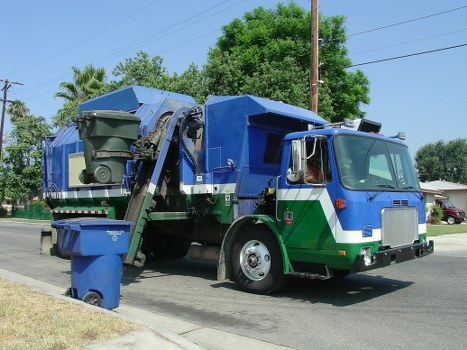 Commercial skip placed in a Kingston upon Thames business area
